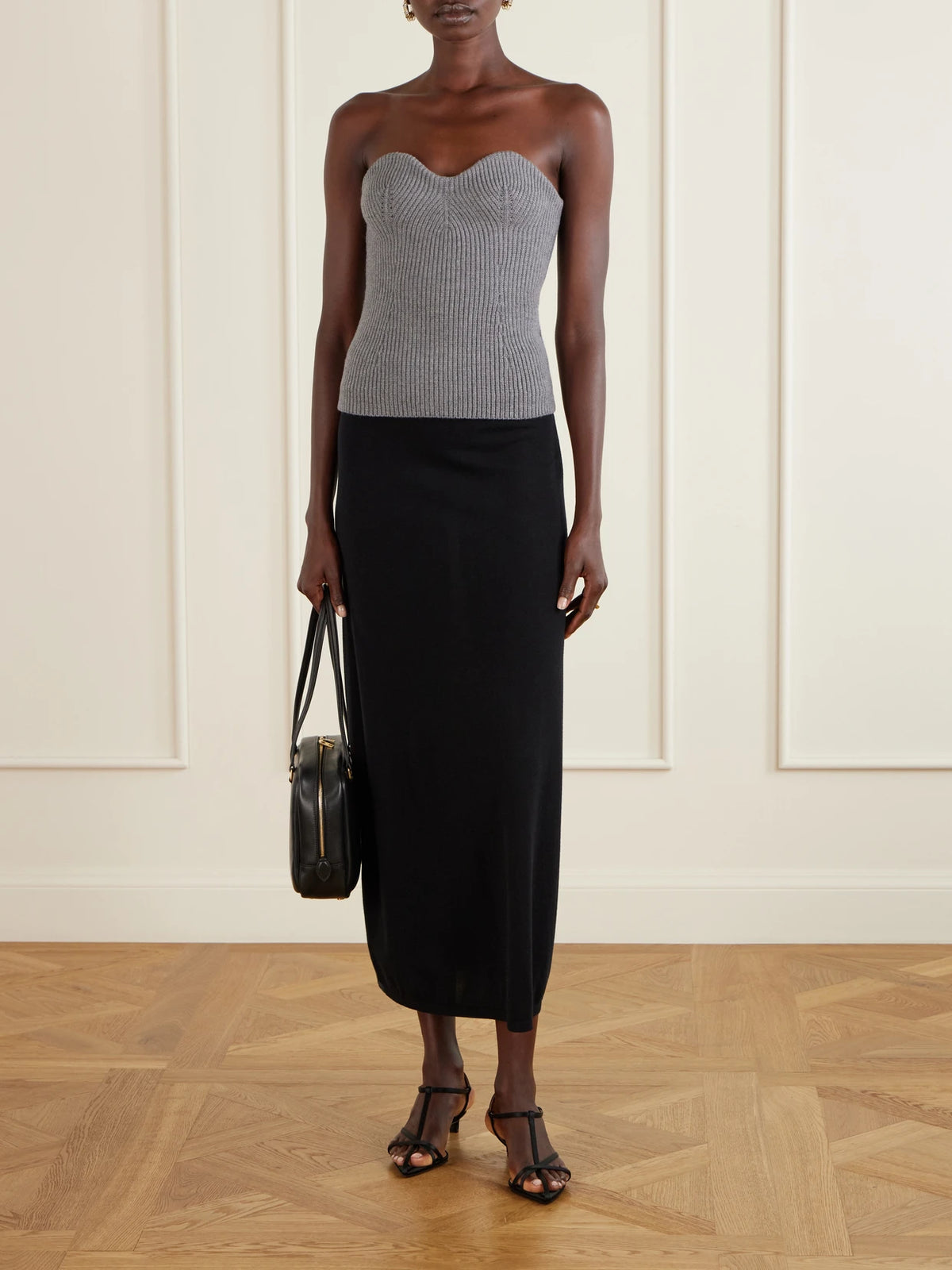 Image of a model wearing Tops. Product name - Strapless Ribbed Wool-blend Bustier Top in Gray colour by brand - Jil Sander