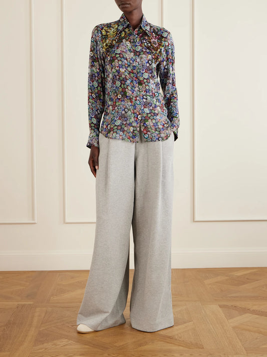 Image of a model wearing Tops. Product name - Sequin-embellished Printed Georgette Blouse in Purple colour by brand - Dries Van Noten