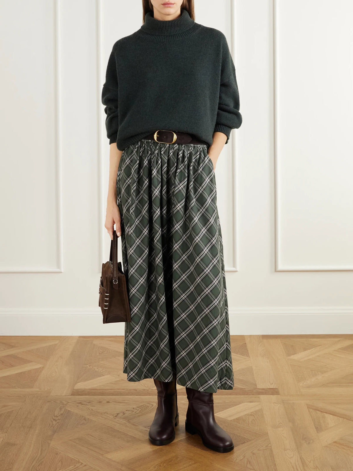 Image of a model wearing Outerwear. Product name - Silene Rib-trimmed Wool Turtleneck Sweater in Dark green colour by brand - SKALL