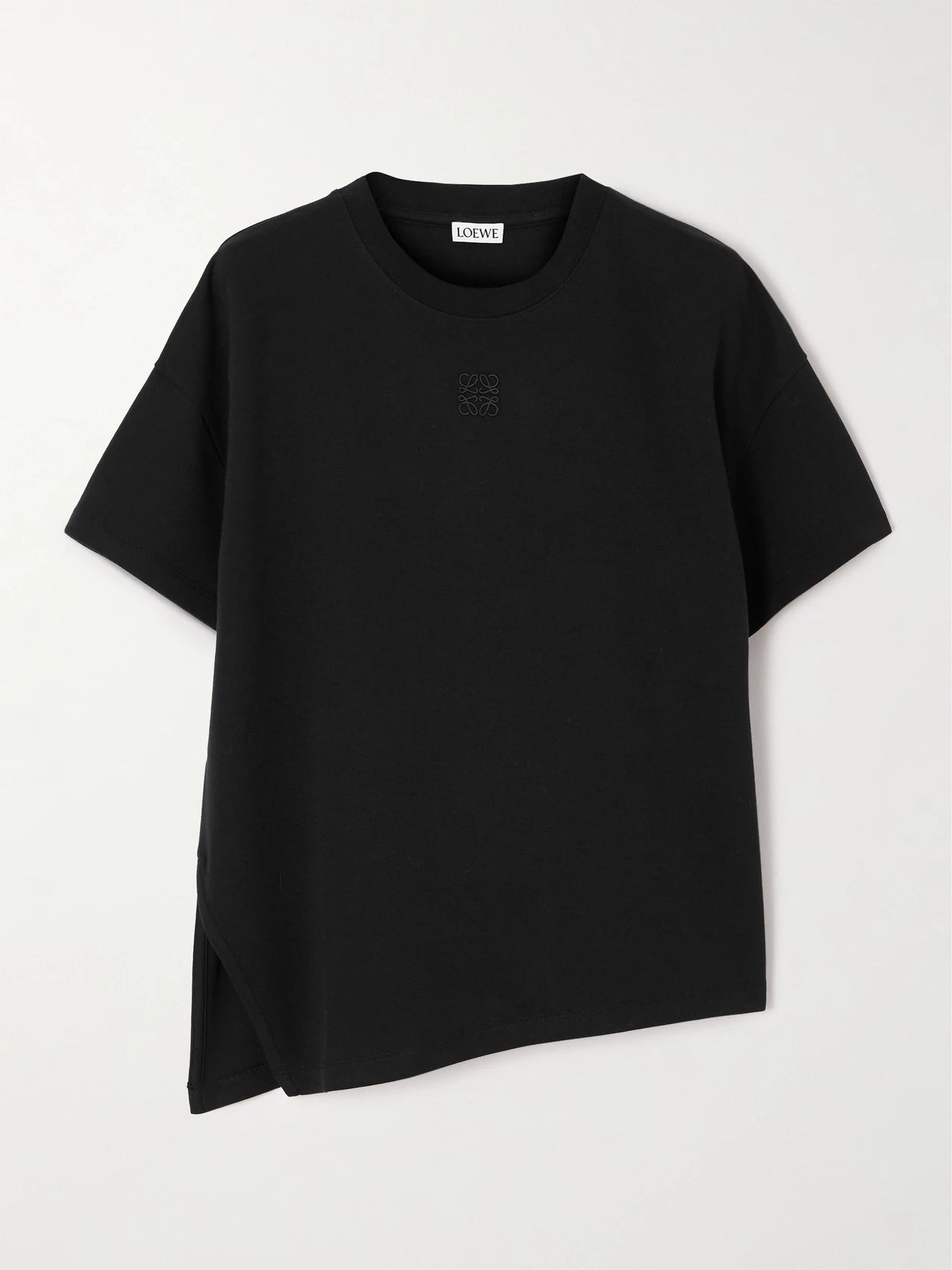 Image of a model wearing Tops. Product name - Anagram Asymmetric Cotton-blend Jersey T-shirt in Black colour by brand - LOEWE