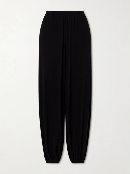 Image of a model wearing Pants. Product name - Fiamma Cotton, Cashmere And Silk-blend Balloon Pants in Black colour by brand - The Row