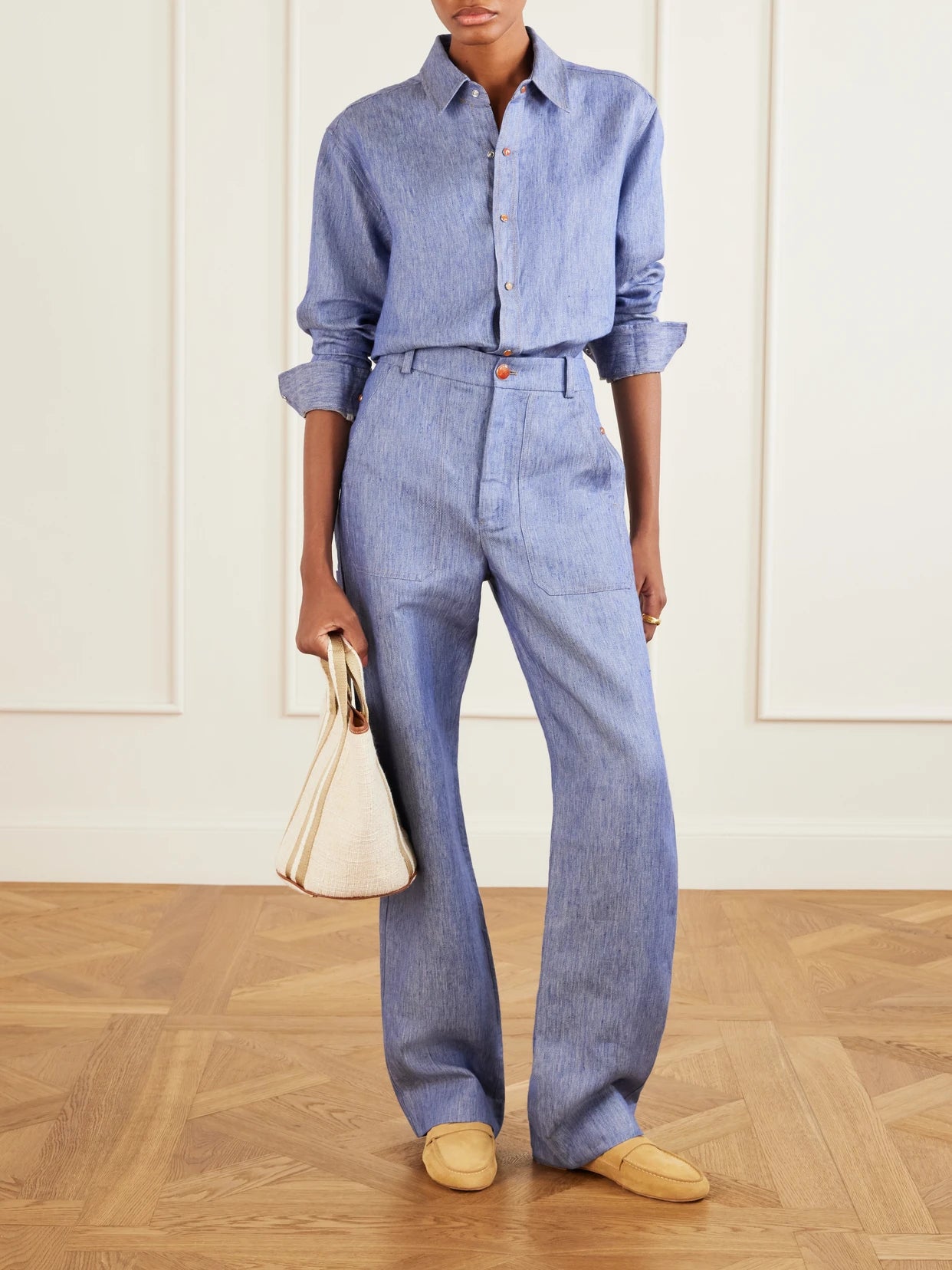Image of a model wearing Pants. Product name - Linen-denim Straight-leg Trousers in Blue colour by brand - God's True Cashmere