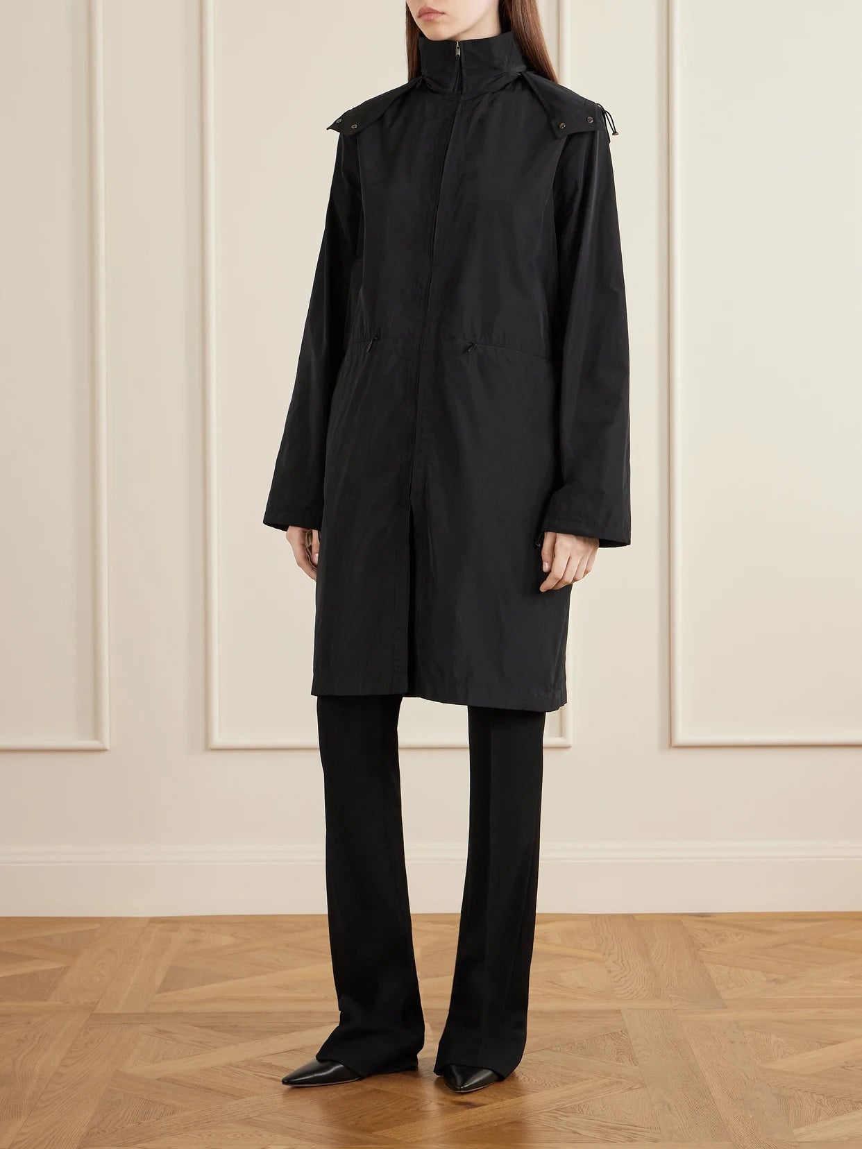 Image of a model wearing Pants. Product name - Fabien Wool-blend Crepe Straight-leg Pants in Black colour by brand - The Row