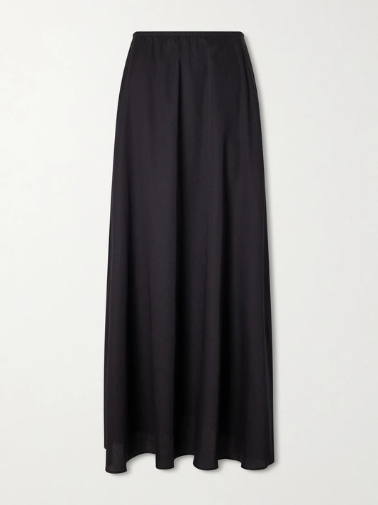 Image of a model wearing Skirts. Product name - Yoko Cotton Maxi Skirt in Black colour by brand - LESET