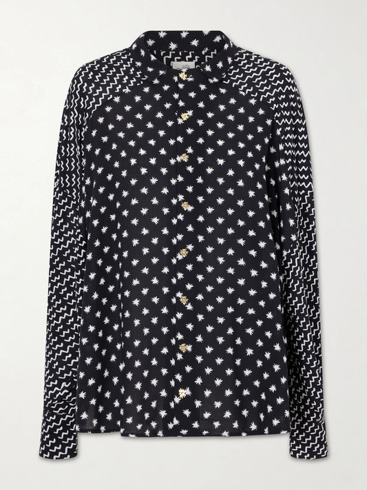 Image of a model wearing Tops. Product name - Estrellitas Y Olas Printed Satin Shirt in Black colour by brand - Donde Esteban
