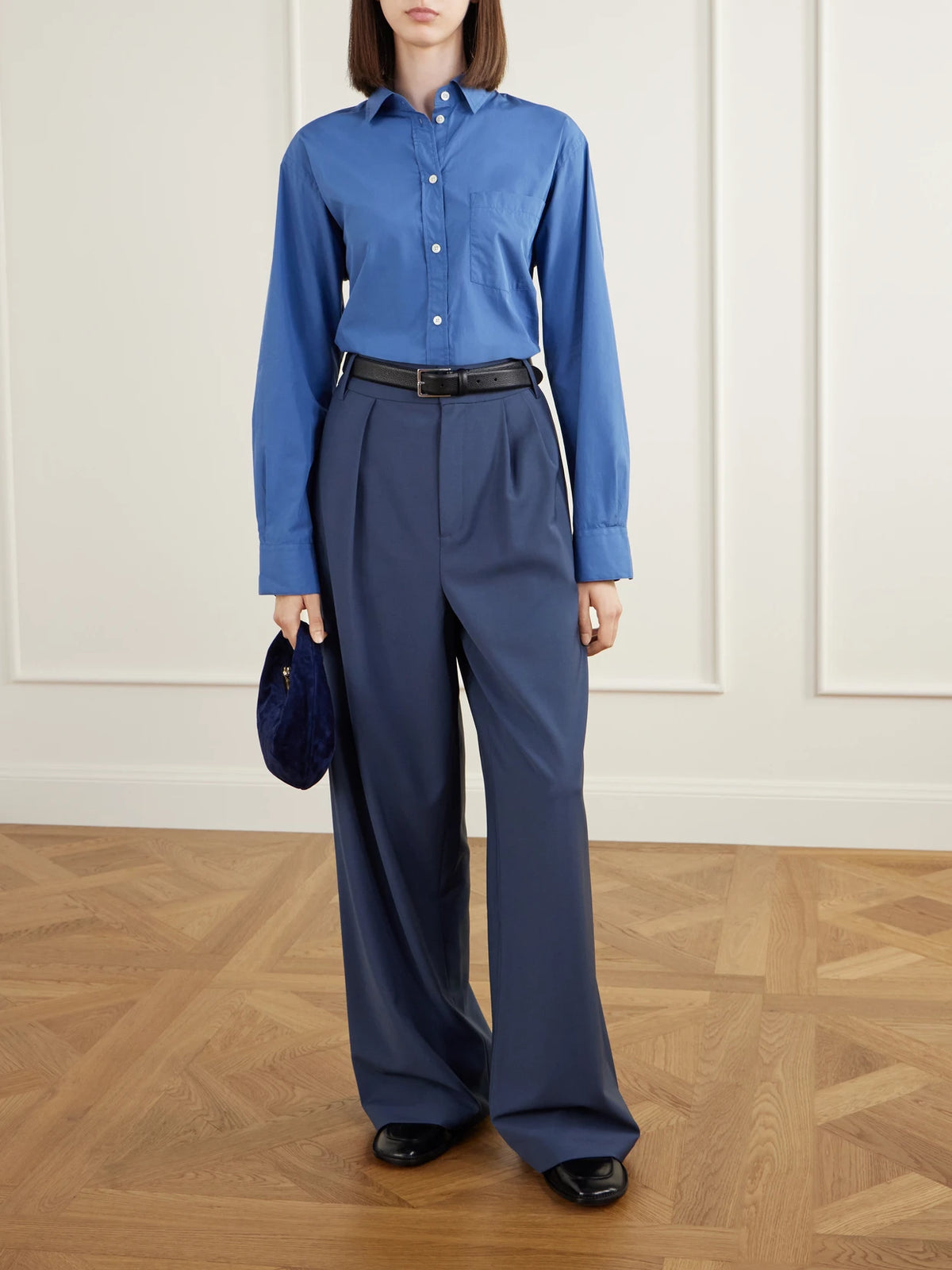 Image of a model wearing Pants. Product name - Woven Wide-leg Pants in Blue colour by brand - Tibi