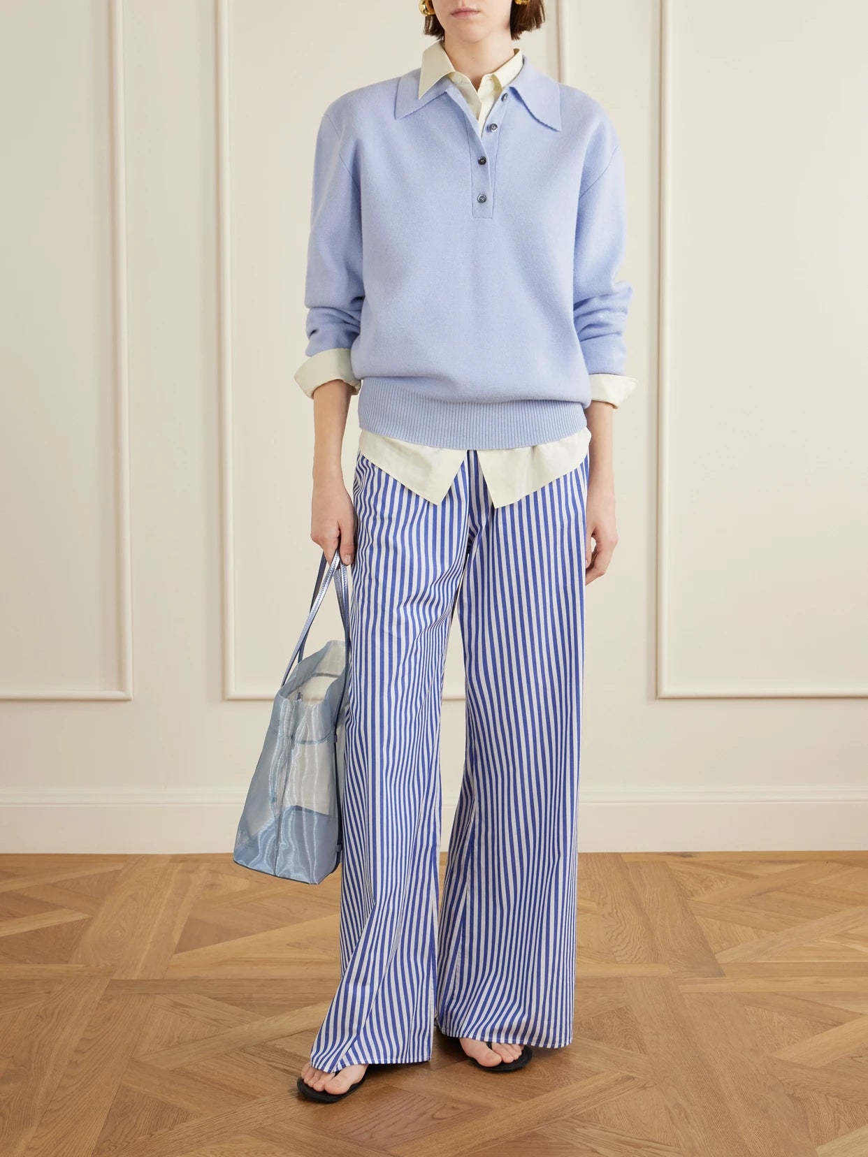 Image of a model wearing Pants. Product name - Striped Cotton Pants in Blue colour by brand - La Ligne