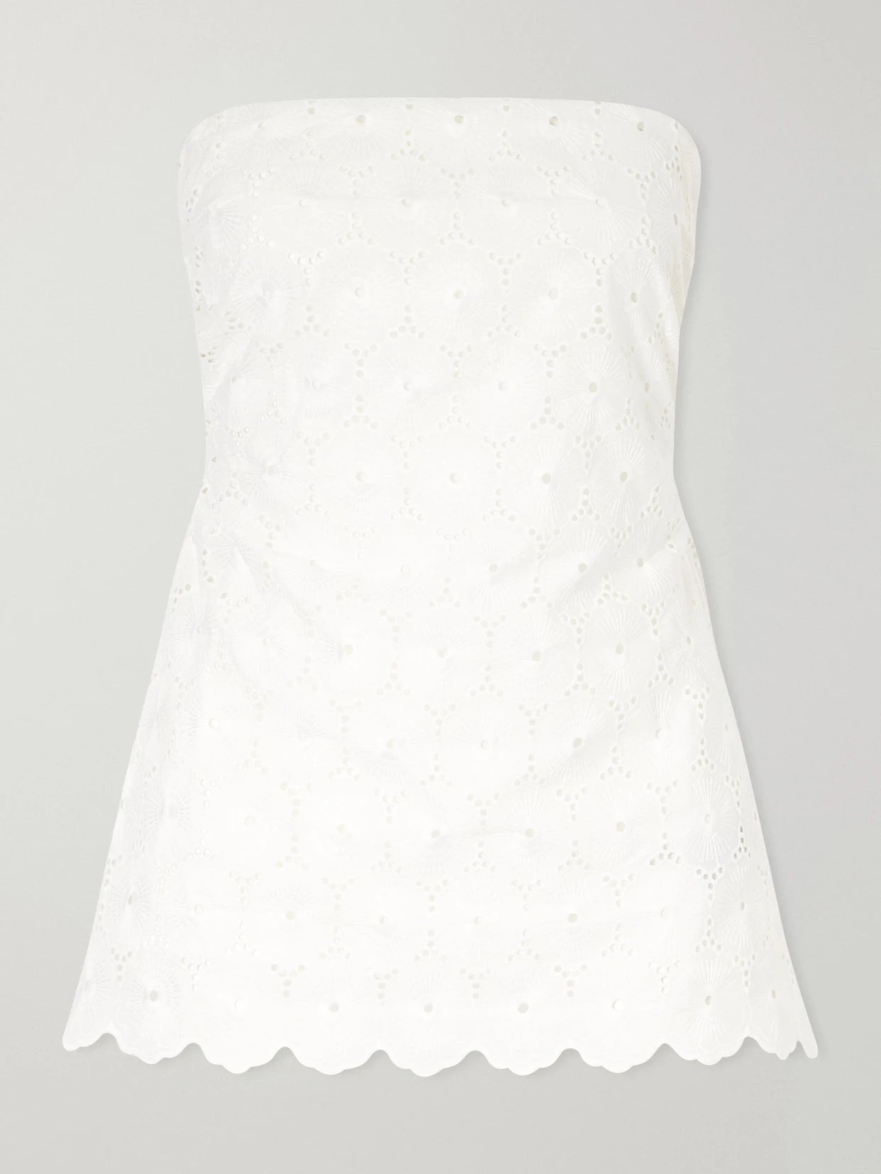 Image of a model wearing Tops. Product name - Pamina Strapless Scalloped Broderie Anglaise Top in White colour by brand - Faithfull