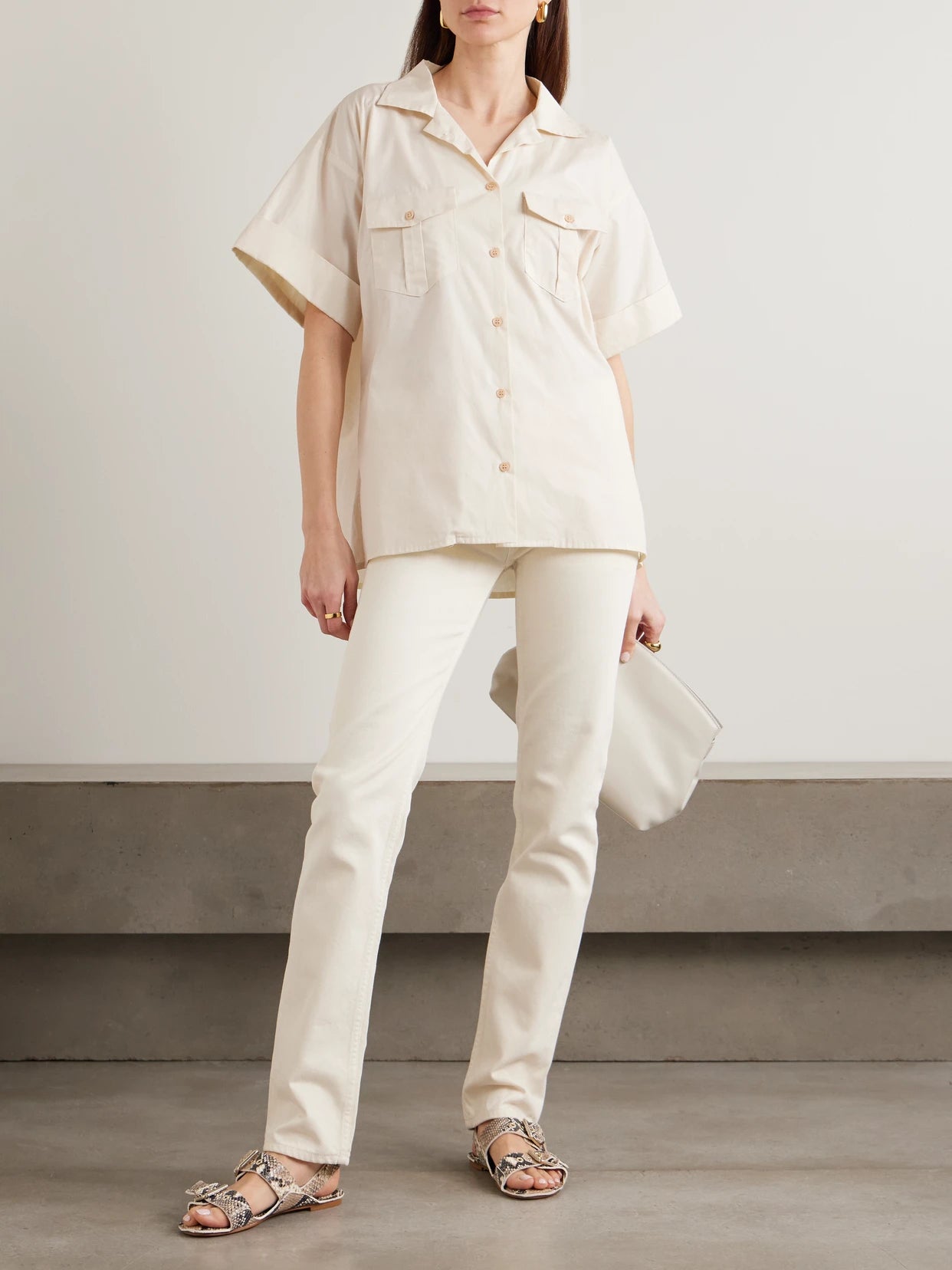 Image of a model wearing Tops. Product name - The Safari Cotton Shirt in Ecru colour by brand - Jamie Haller