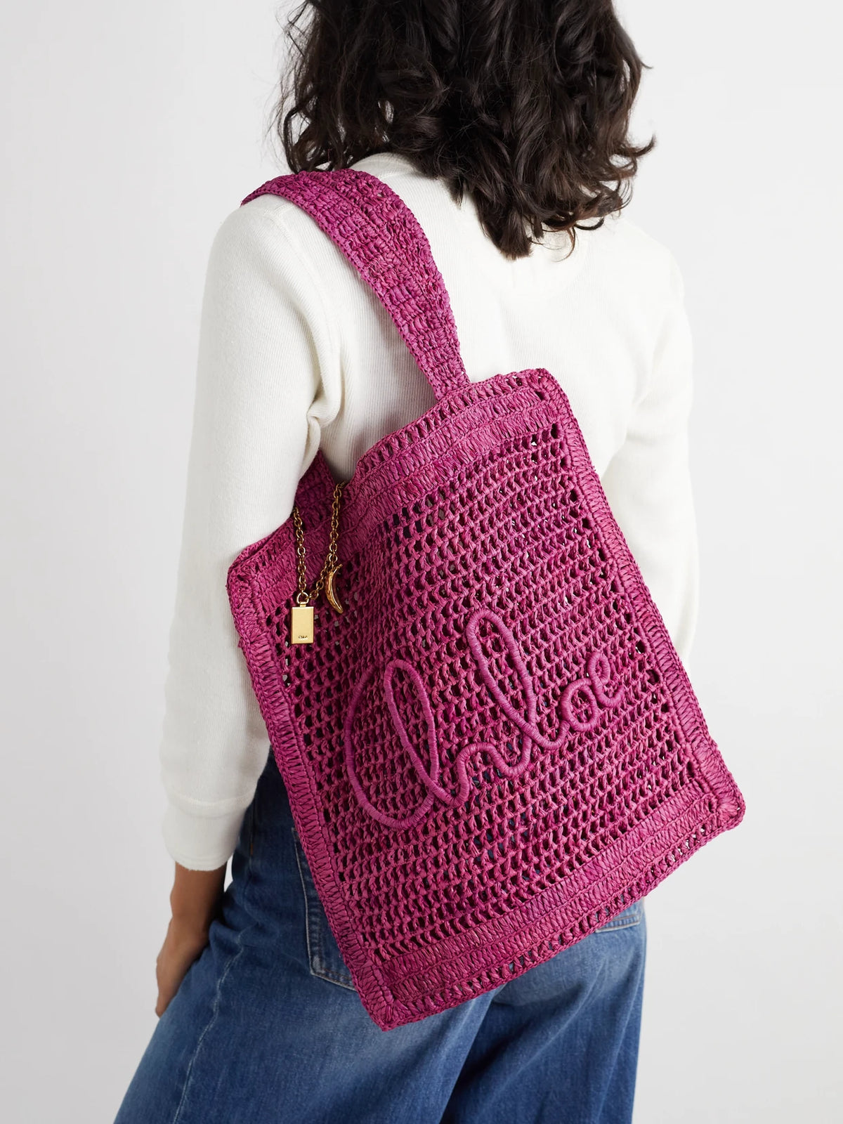 Image of Bags. Product name - Summer Banana Embellished Crocheted Raffia Tote in Fuchsia colour by brand - Chloé