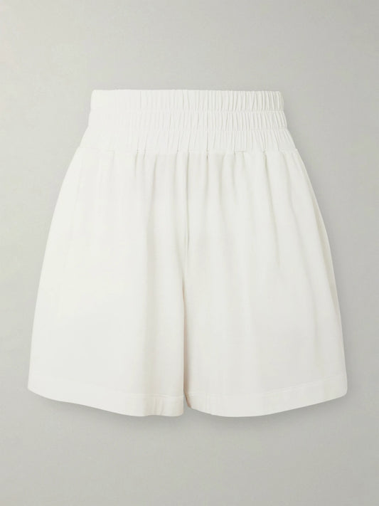Image of a model wearing Shorts. Product name - Mia Embroidered Modal-blend Jersey Shorts in White colour by brand - Eres