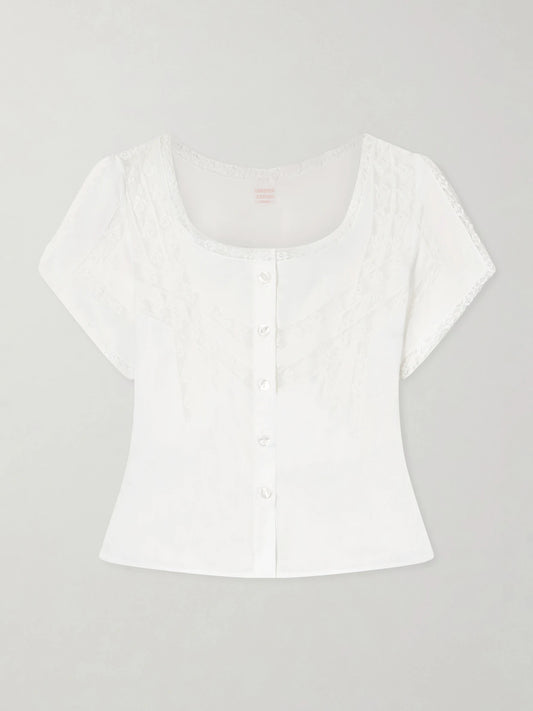 Image of a model wearing Tops. Product name - Angela Lace-trimmed Cotton Blouse in White colour by brand - Loretta Caponi