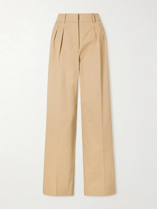 Image of a model wearing Pants. Product name - Appliquéd Pleated Cotton-twill Wide-leg Pants in Tan colour by brand - Moncler