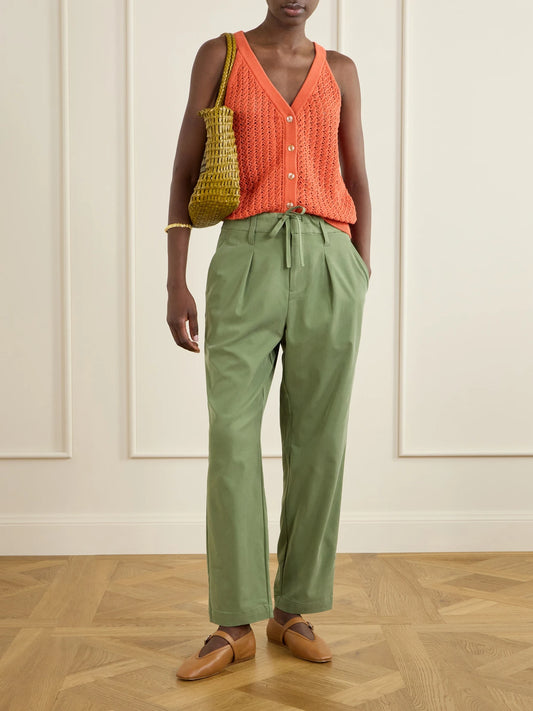 Image of a model wearing Tops. Product name - Alessia Crochet-knit Cotton Top in Orange colour by brand - Varley