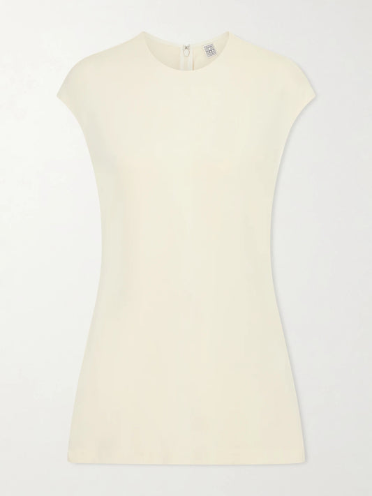 Image of a model wearing Tops. Product name - Everyday Jersey Top in Ecru colour by brand - TOTEME