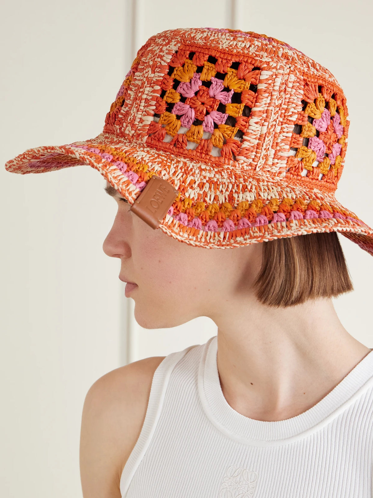 Image of Hats. Product name - + Paula's Ibiza Crocheted Raffia Bucket Hat in Orange colour by brand - LOEWE