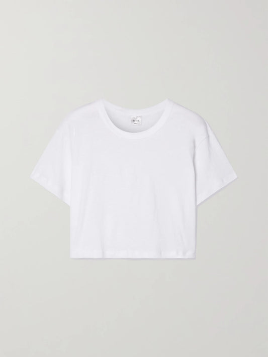 Image of a model wearing Tops. Product name - Cropped Slub Cotton-jersey T-shirt in White colour by brand - LESET