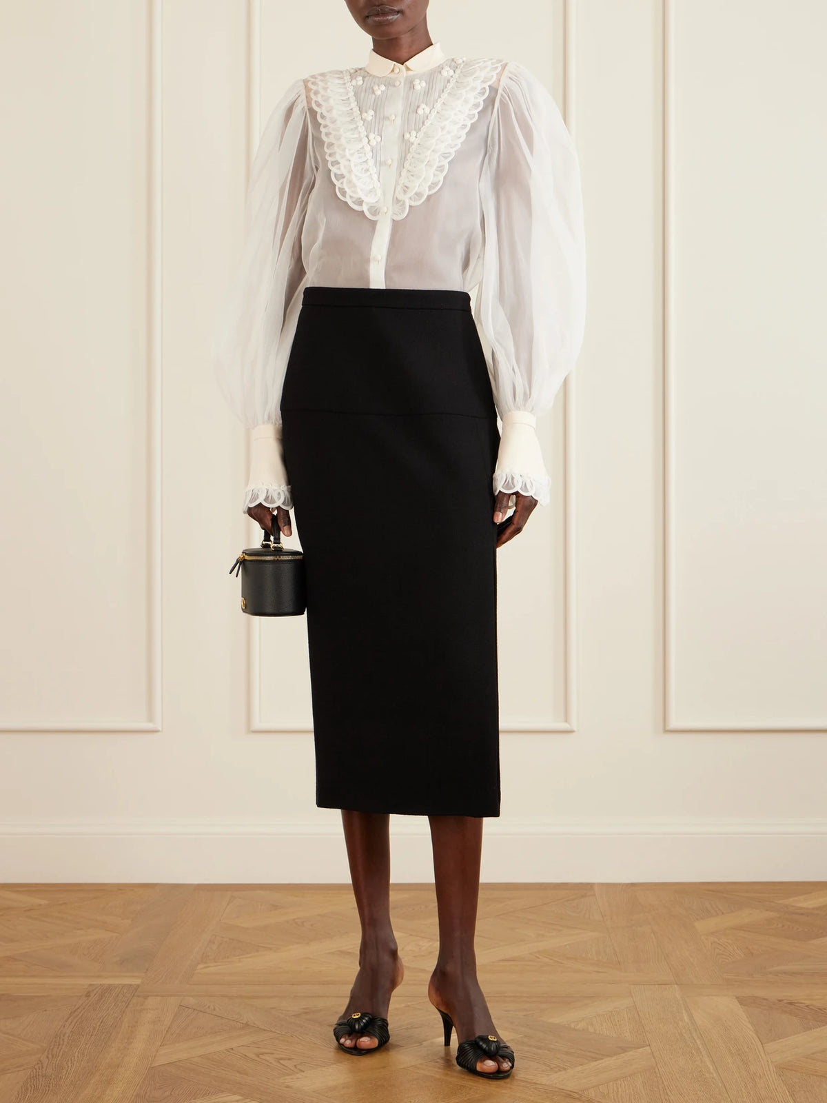 Image of a model wearing Tops. Product name - Silk-organza Blouse in Ivory colour by brand - Valentino Garavani