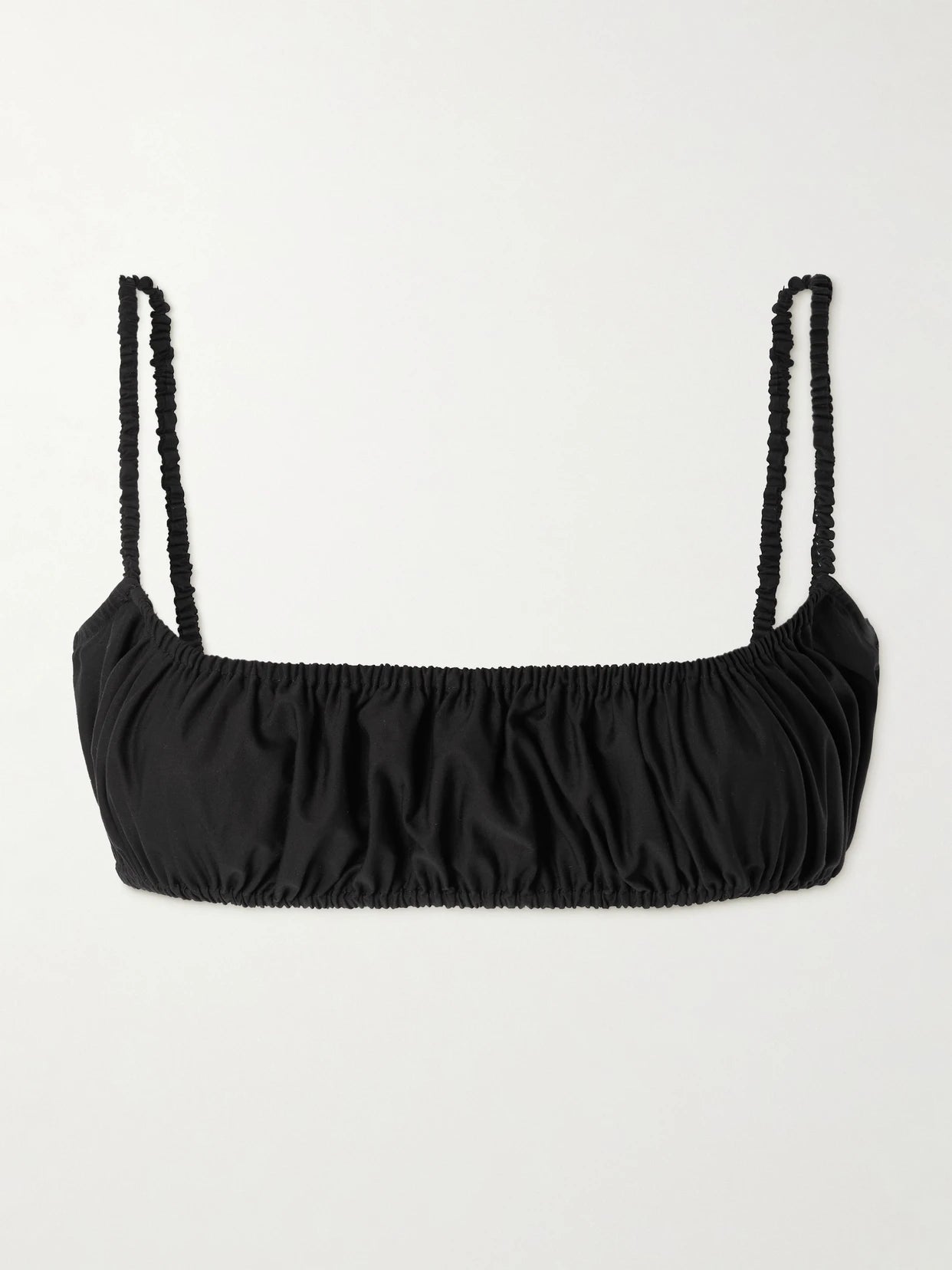 Image of a model wearing Tops. Product name - Gathered Cotton-poplin Bralette in Black colour by brand - Alaïa