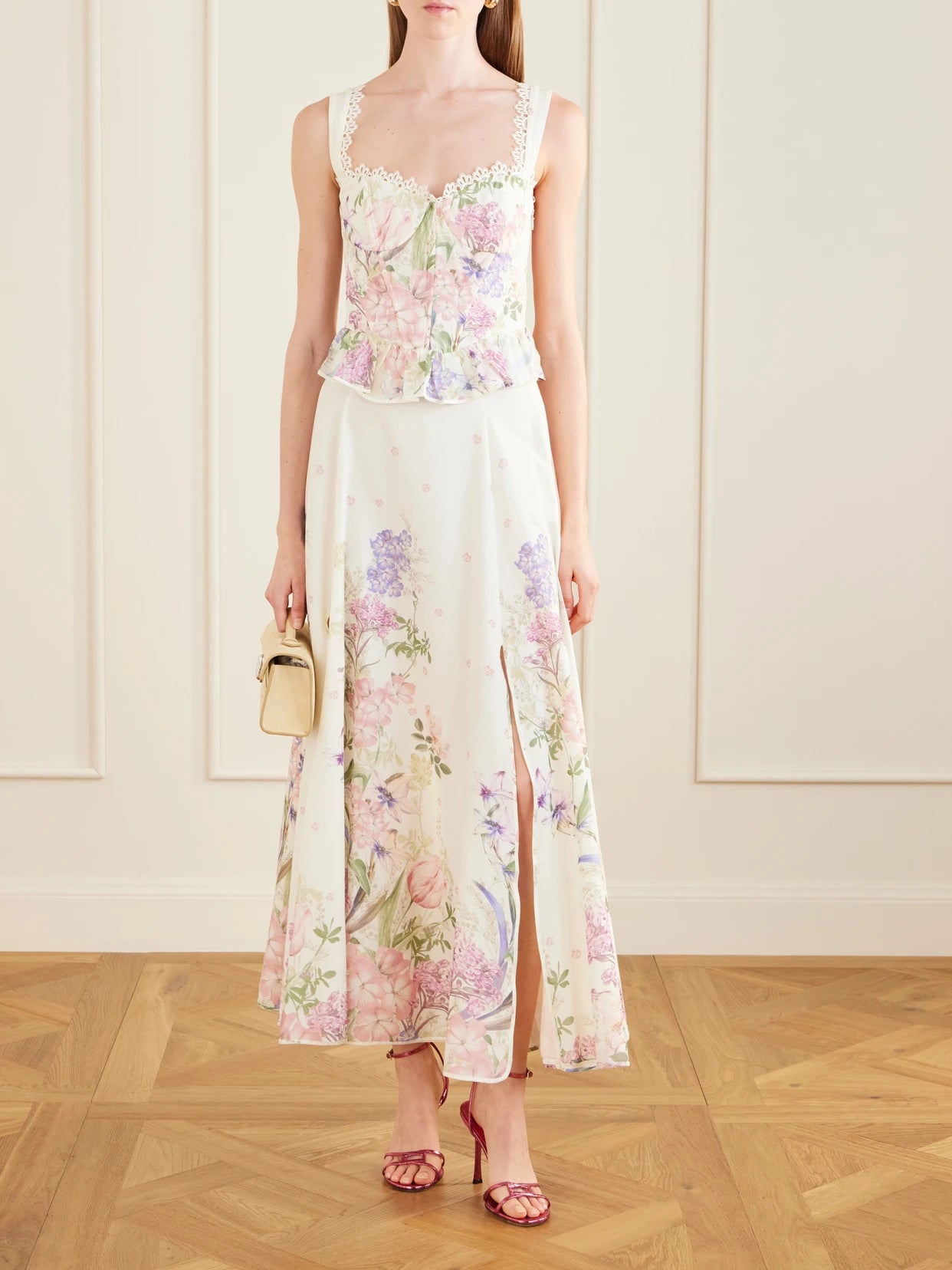 Image of a model wearing Skirts. Product name - Ventine Floral-print Cotton-blend Maxi Skirt in Cream colour by brand - Charo Ruiz