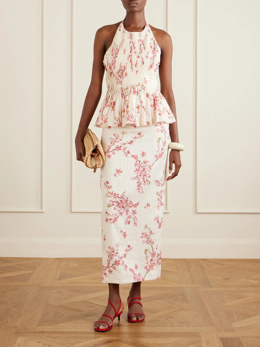 Image of a model wearing Skirts. Product name - Lirica Cauca Floral-print Linen Maxi Skirt in Pink colour by brand - Agua by Agua Bendita