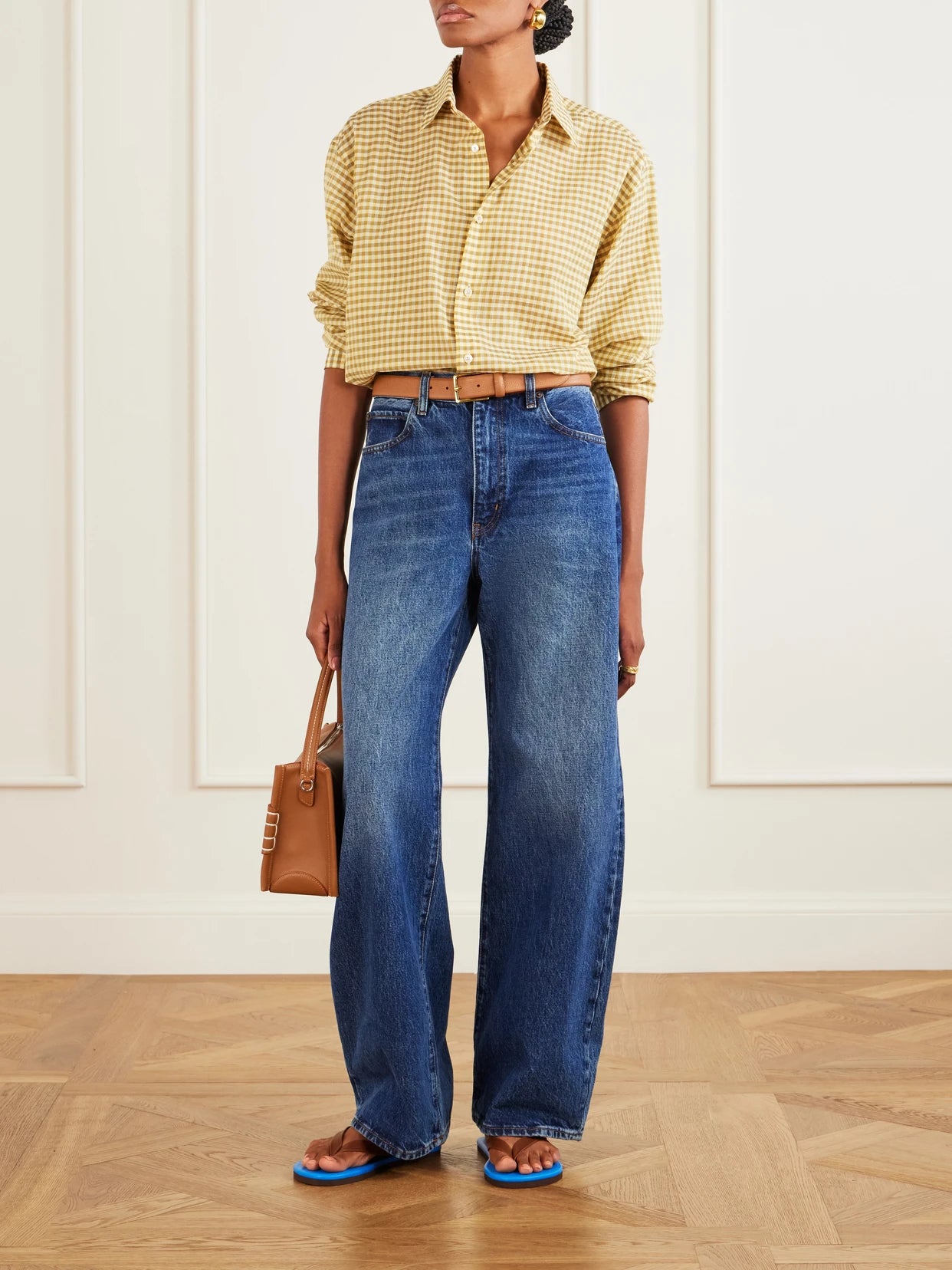Image of a model wearing Tops. Product name - Check Cotton Shirt in Yellow colour by brand - Auralee