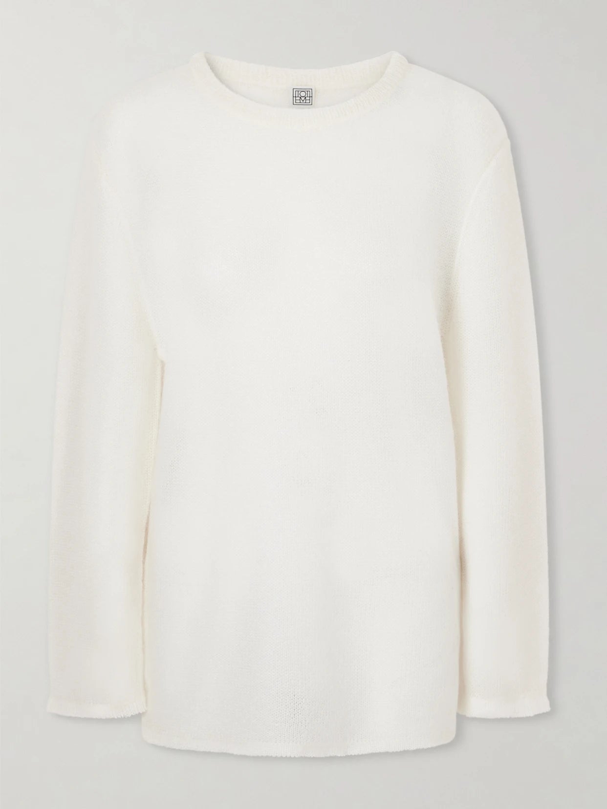 Image of a model wearing Outerwear. Product name - Mohair-blend Sweater in Off-white colour by brand - TOTEME