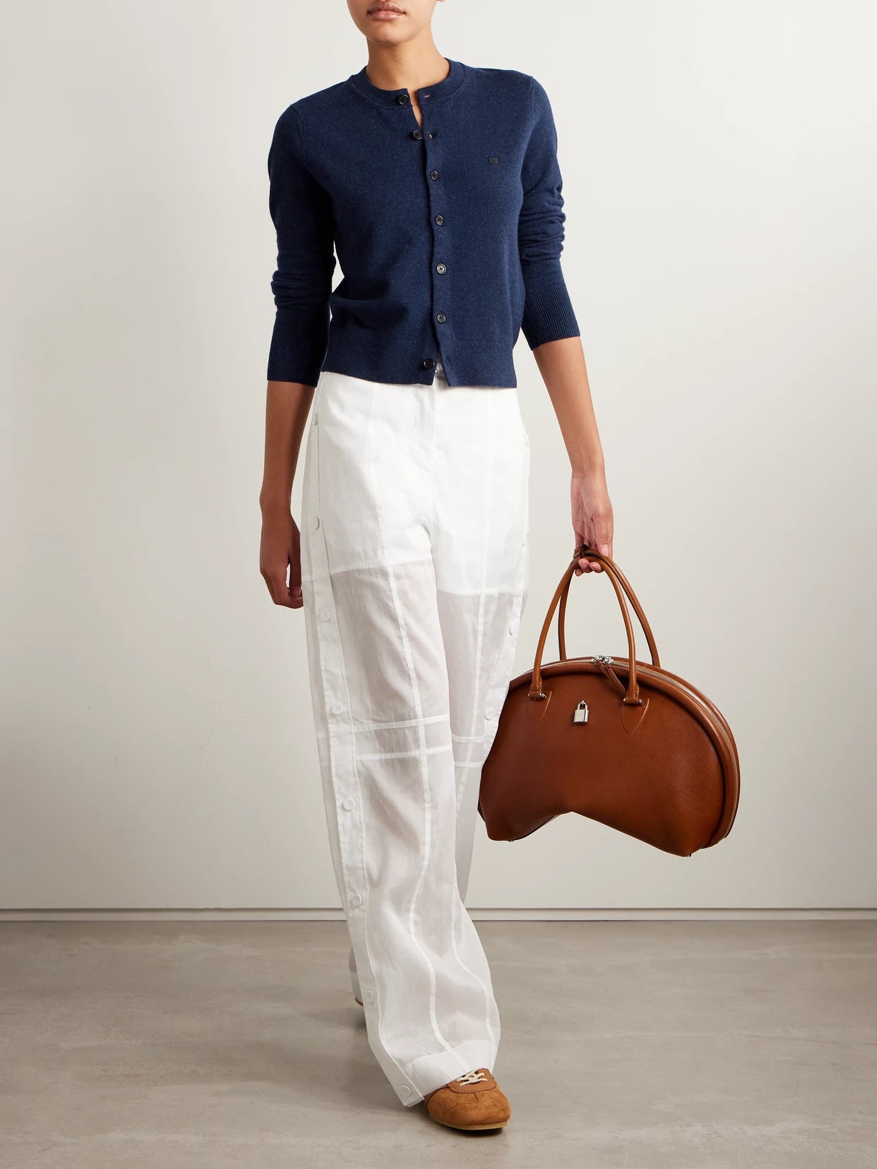 Image of a model wearing Outerwear. Product name - Appliquéd Wool Cardigan in Navy colour by brand - Acne Studios