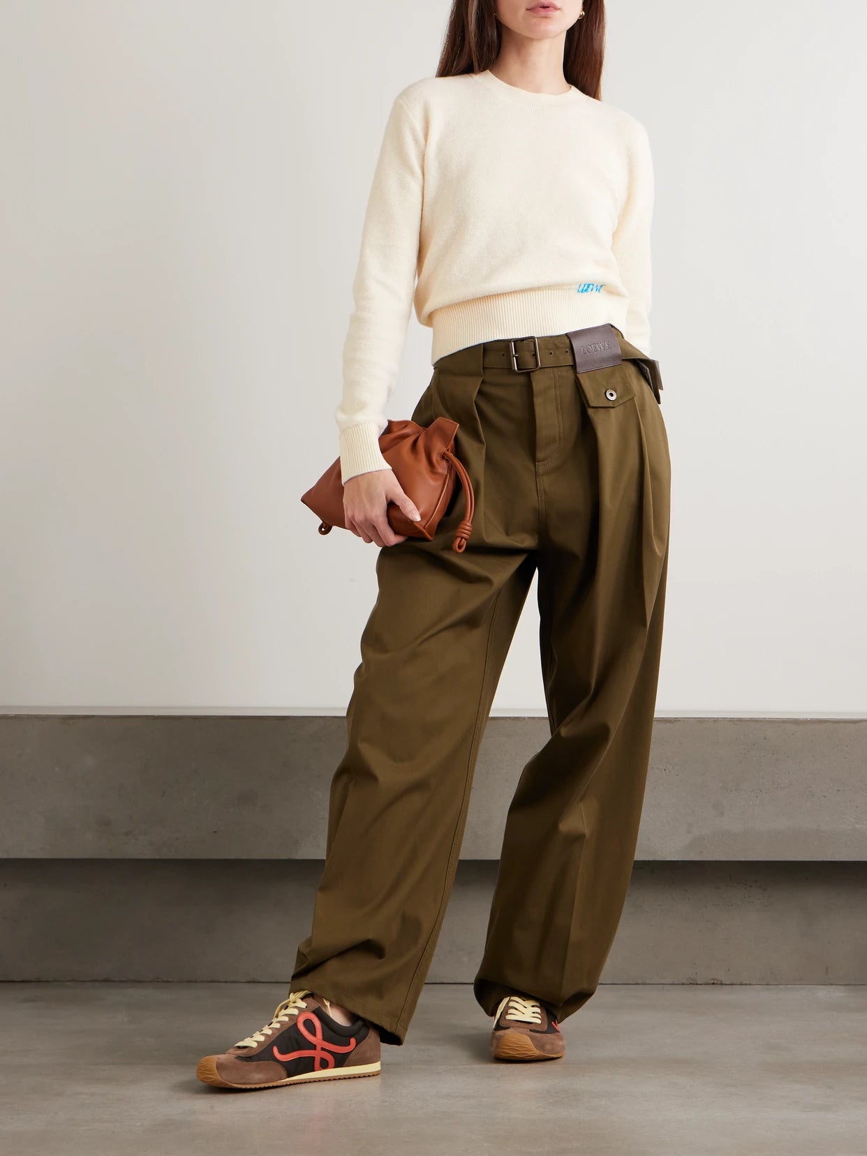 Image of a model wearing Outerwear. Product name - Embroidered Wool Sweater in Ecru colour by brand - LOEWE