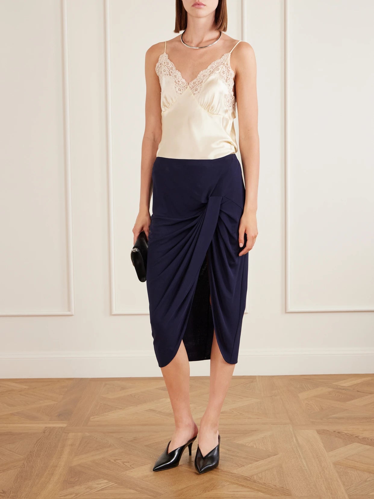 Image of a model wearing Skirts. Product name - Draped Stretch-jersey Midi Skirt in Navy colour by brand - Stella McCartney