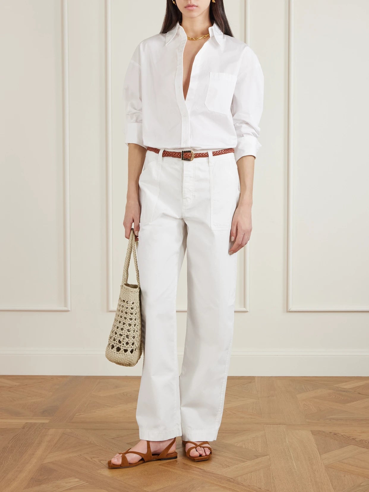 Image of a model wearing Pants. Product name - Cotton Straight-leg Pants in Off-white colour by brand - Matteau