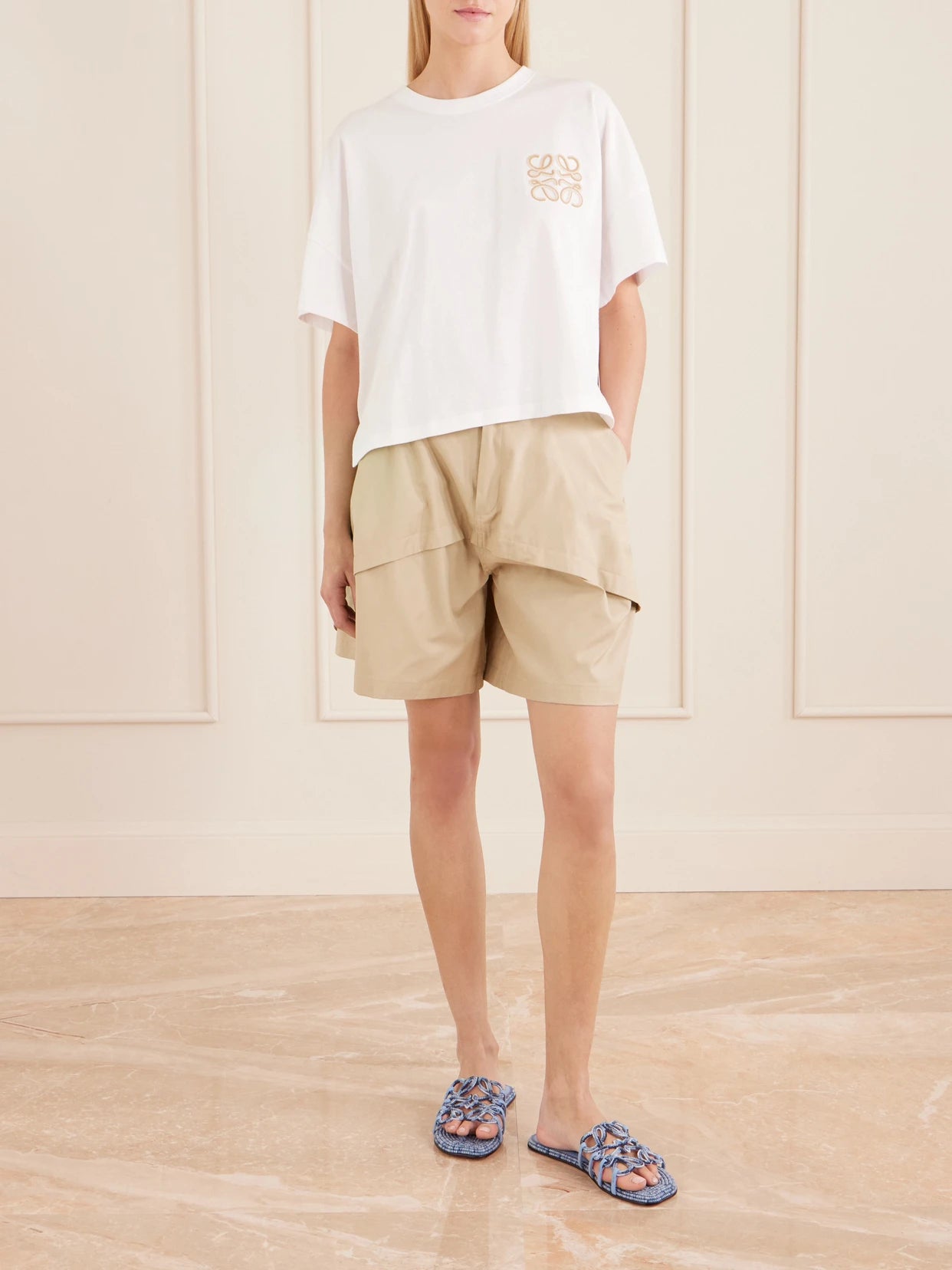 Image of a model wearing Shorts. Product name - + Paula's Ibiza Paneled Cotton Gabardine Shorts in Beige colour by brand - LOEWE