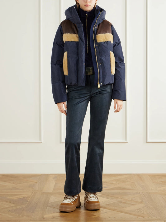 Image of a model wearing Tops. Product name - Serena Paneled Stretch-jersey Ski Top in Navy colour by brand - Goldbergh