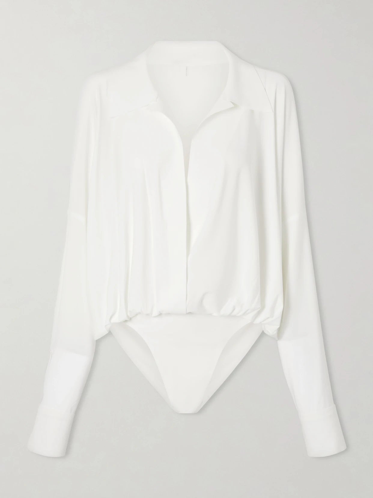 Image of a model wearing Tops. Product name - Jersey Bodysuit in White colour by brand - Norma Kamali