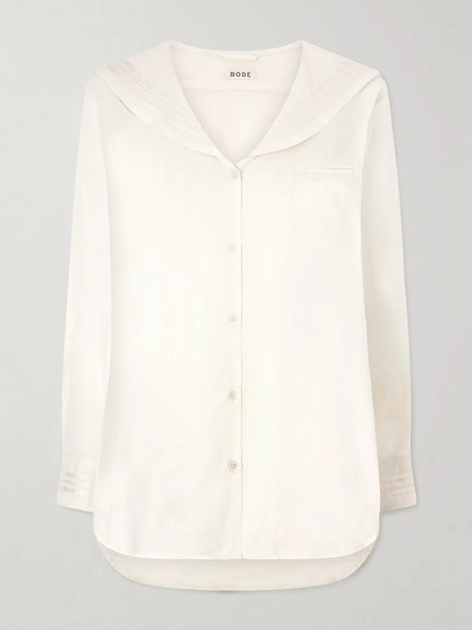 Image of a model wearing Tops. Product name - Marina Cotton-voile Shirt in Ivory colour by brand - BODE