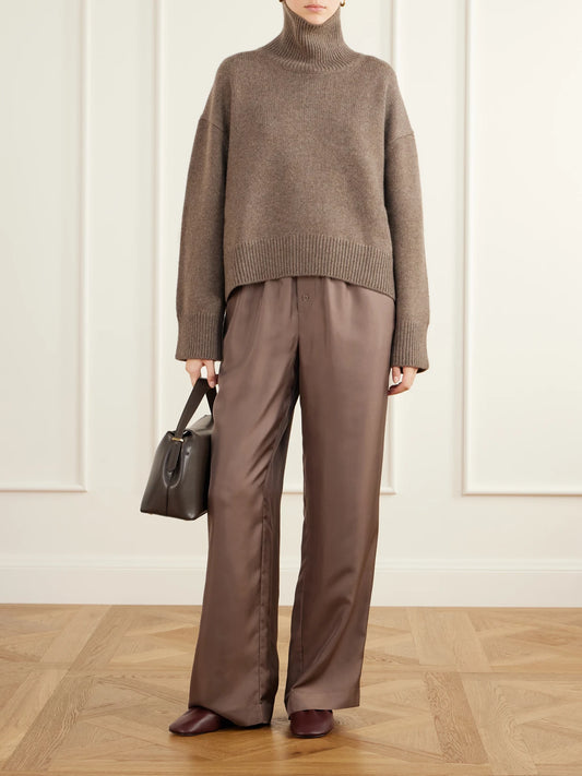 Image of a model wearing Outerwear. Product name - Jonah Cropped Cashmere Turtleneck Sweater in Brown colour by brand - Loulou de Saison