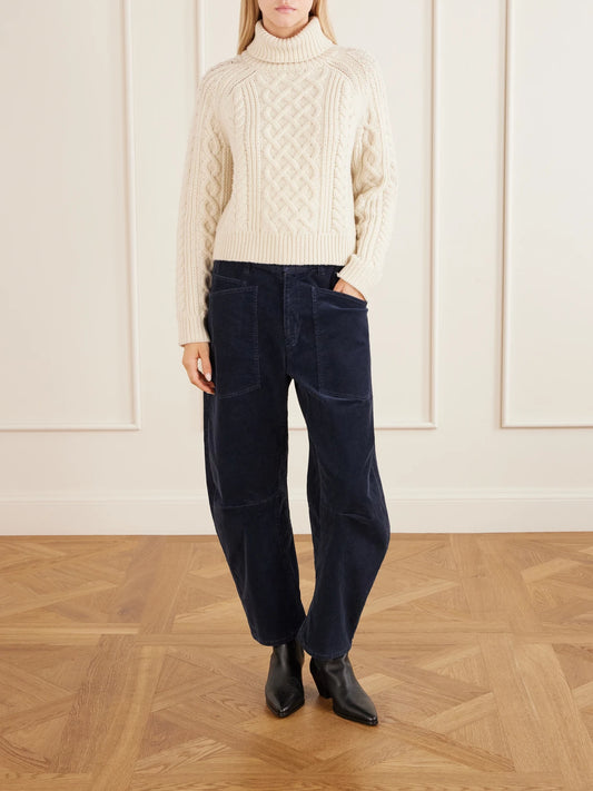 Image of a model wearing Outerwear. Product name - Ezren Textured Lambswool Turtleneck Sweater in Ivory colour by brand - Nili Lotan