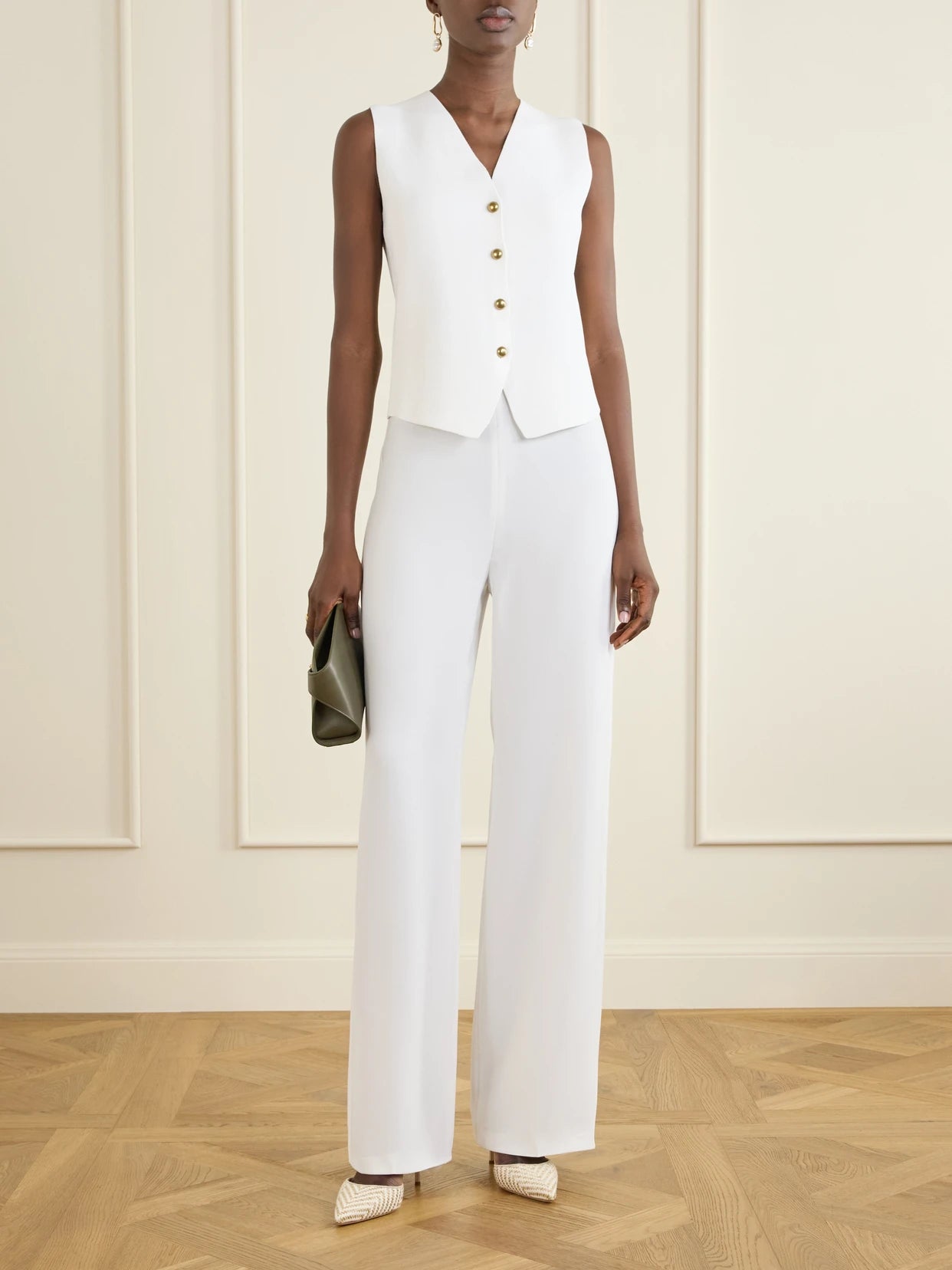 Image of a model wearing Pants. Product name - Woven Wide-leg Pants in White colour by brand - Max Mara