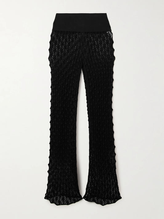 Image of a model wearing Pants. Product name - Open-knit Straight-leg Pants in Black colour by brand - Alaïa