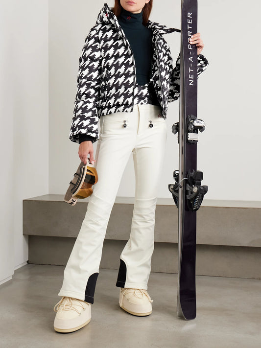 Image of a model wearing Pants. Product name - Aurora Embroidered Bootcut Ski Pants in White colour by brand - Perfect Moment