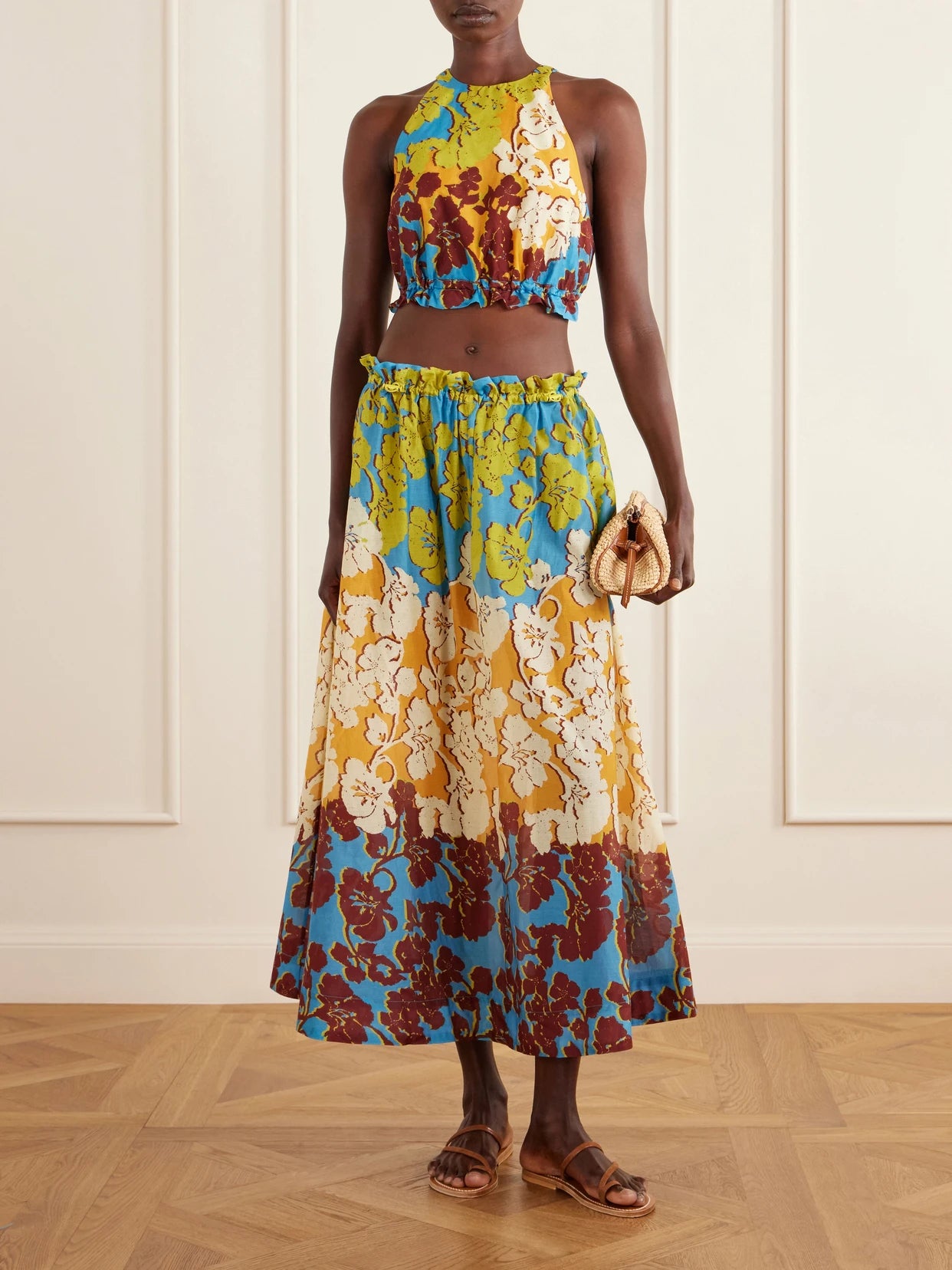 Image of a model wearing Skirts. Product name - Splice Floral-print Cotton And Silk-blend Midi Skirt in Multi colour by brand - ALÉMAIS