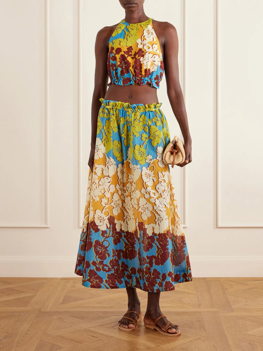 Image of a model wearing Skirts. Product name - Splice Floral-print Cotton And Silk-blend Midi Skirt in Multi colour by brand - ALÉMAIS