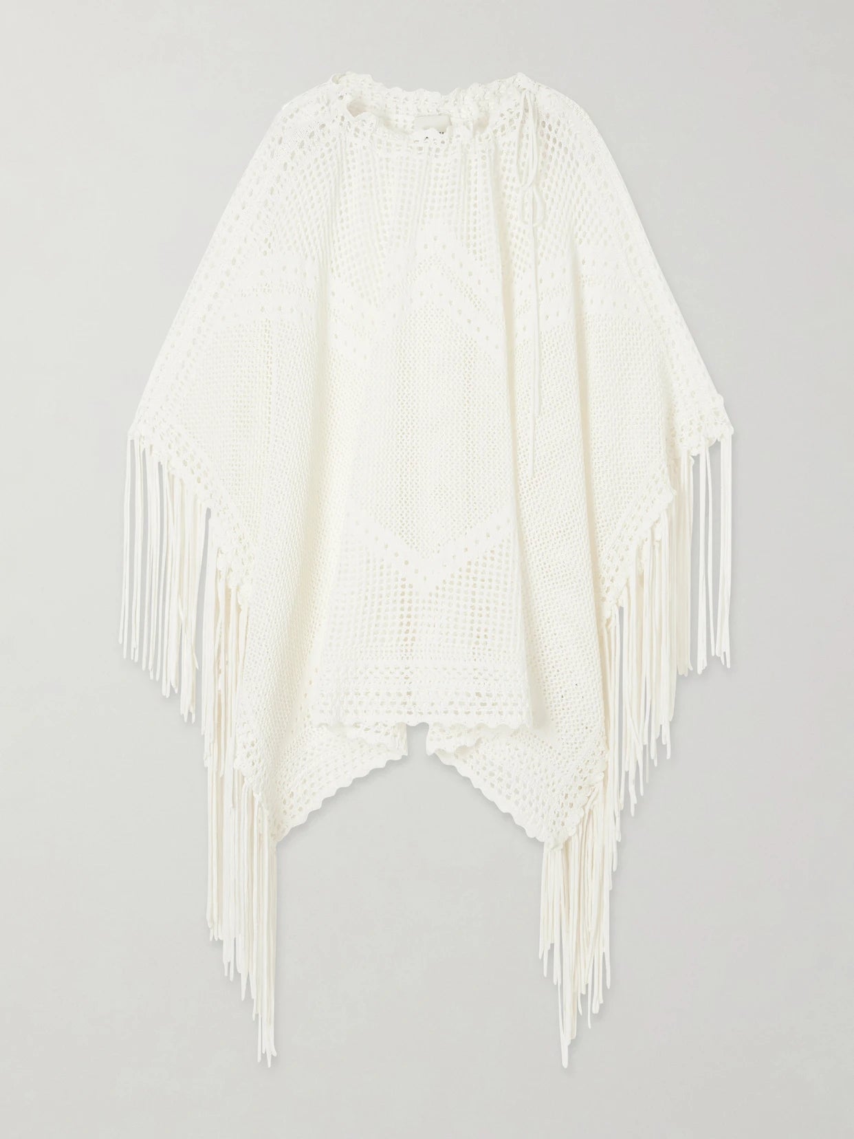 Image of a model wearing Tops. Product name - Metilia Crocheted Fringed Cotton Top in Ecru colour by brand - ISABEL MARANT
