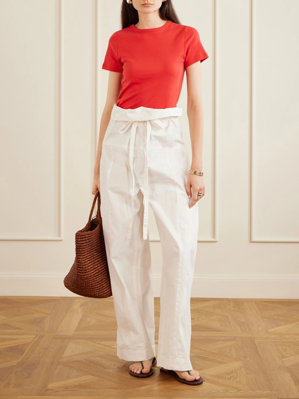 Image of a model wearing Pants. Product name - Fisherman Cotton-twill Pants in White colour by brand - Matteau