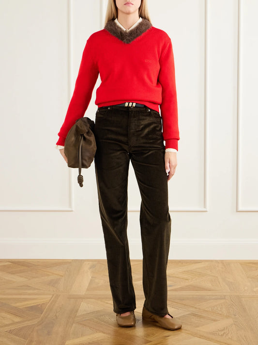 Image of a model wearing Outerwear. Product name - Plush-trimmed Ribbed Wool Sweater in Red, Purple colour by brand - LOEWE