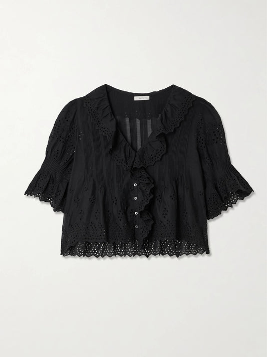 Image of a model wearing Tops. Product name - Henri Cropped Ruffled Pintucked Broderie Anglaise Cotton Top in Black colour by brand - DÔEN