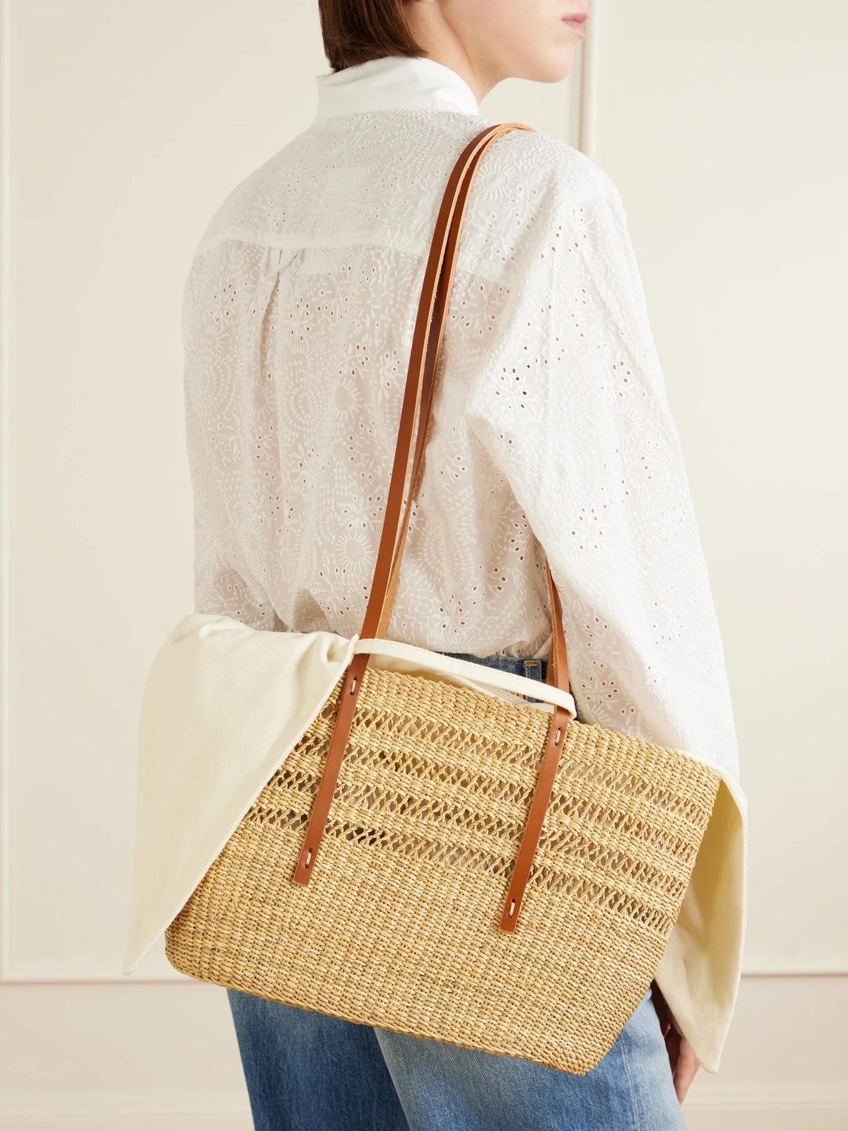 Image of Bags. Product name - Bicro M Leather-trimmed Woven Straw Tote in Neutral colour by brand - MUUÑ
