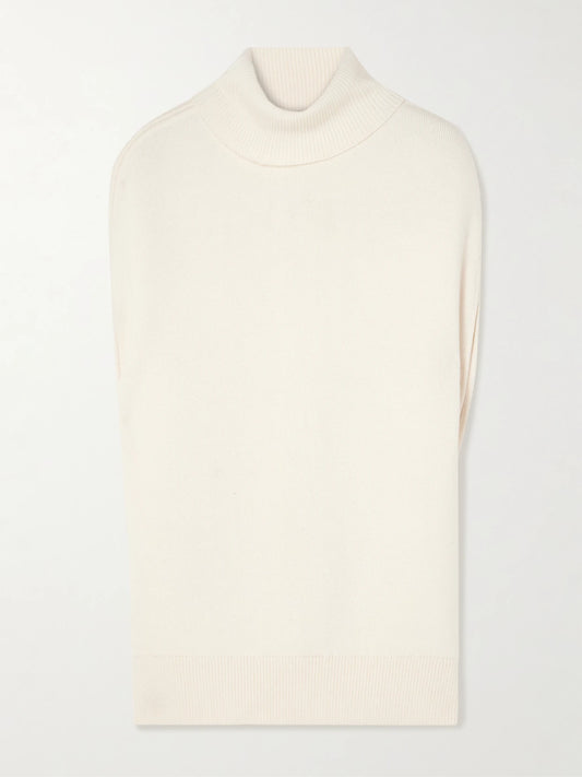 Image of a model wearing Outerwear. Product name - Oversized Knitted Wool Turtleneck Tank in White colour by brand - TOTEME