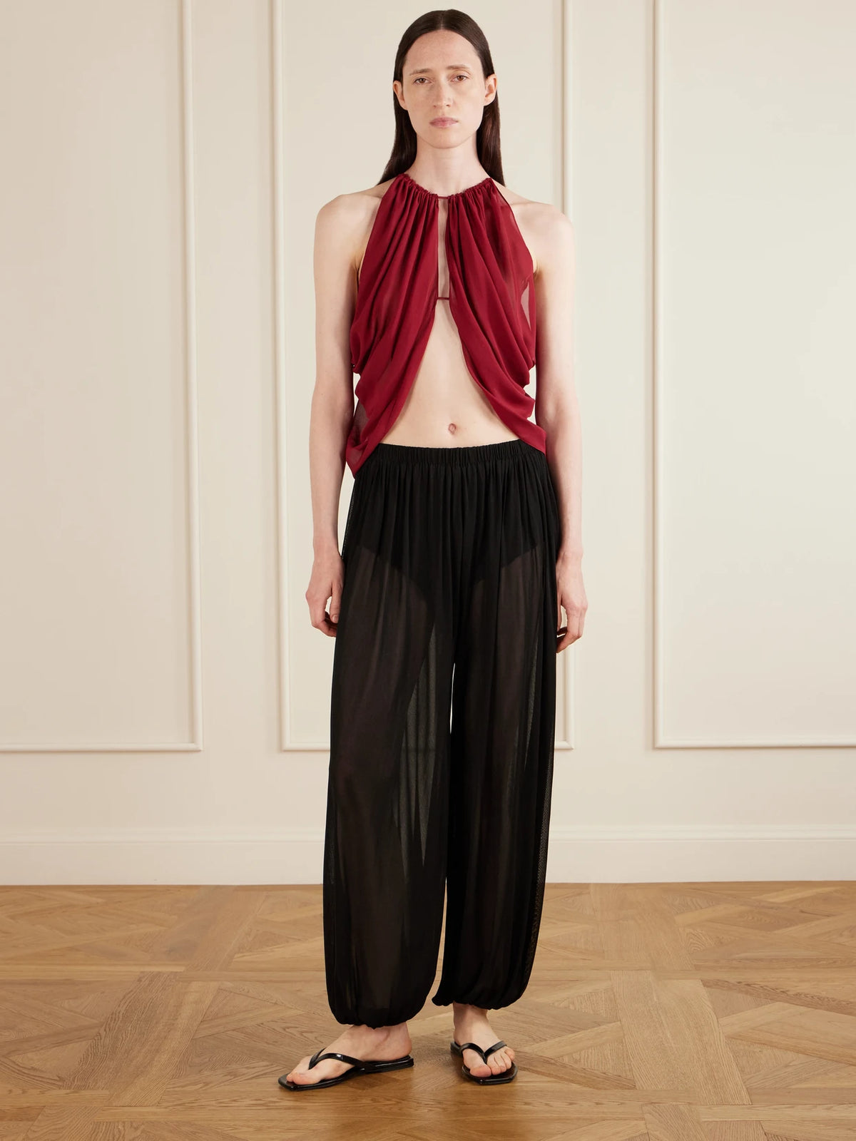 Image of a model wearing Tops. Product name - Reysa Ruched Silk-crepe Top in Burgundy colour by brand - AFLALO