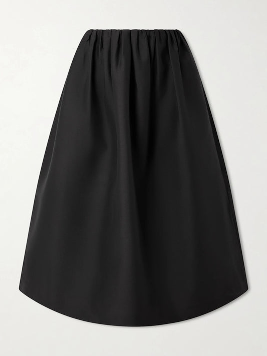 Image of a model wearing Skirts. Product name - Gathered Wool And Silk-blend Midi Skirt in Black colour by brand - TOTEME